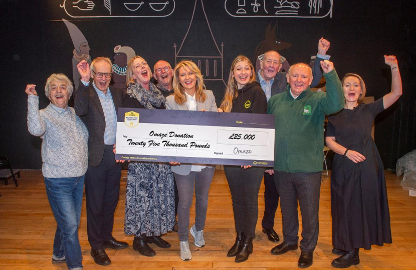 Esther with two charities benefitting from the donation