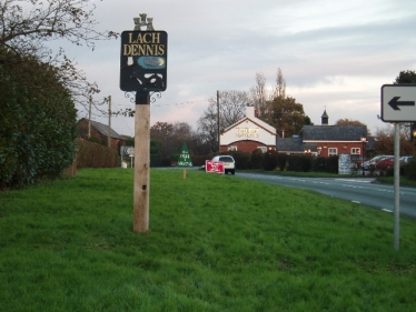 Lach Dennis village sign post