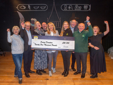 Esther with two charities benefitting from the donation