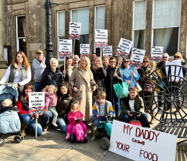 Esther with farmers and their families at a protest rally